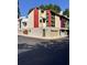 View of the colorful townhome featuring garage and ample windows at 1400 Peter Haughton Nw Way, Atlanta, GA 30318