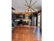 Modern kitchen with stainless steel appliances, dark wood cabinets, and a view of the living room at 1400 Peter Haughton Nw Way, Atlanta, GA 30318