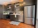 Well-appointed kitchen with dark cabinets, stainless steel appliances, and bright countertops at 1400 Peter Haughton Nw Way, Atlanta, GA 30318