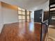 Spacious living area with hardwood floors, large windows and access to the open-concept kitchen at 1400 Peter Haughton Nw Way, Atlanta, GA 30318