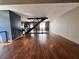 An open living space with hardwood floors, a modern staircase and access to the kitchen at 1400 Peter Haughton Nw Way, Atlanta, GA 30318