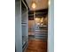 Walk-in closet with custom shelving, drawers, and hardwood floors at 1400 Peter Haughton Nw Way, Atlanta, GA 30318