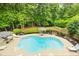 From above, view this home's pool, lush landscaping, and outdoor seating areas create a private and inviting oasis at 1811 Ascot Nw Cv, Acworth, GA 30102