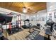This basement has been converted into a home gym with workout equipment and a wall-mounted TV at 1811 Ascot Nw Cv, Acworth, GA 30102