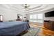 Spacious bedroom features a tray ceiling, hardwood floors, and large windows for ample light at 1811 Ascot Nw Cv, Acworth, GA 30102