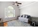 The bedroom features a vaulted ceiling and a view out to a large bay window at 1811 Ascot Nw Cv, Acworth, GA 30102