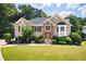 Charming traditional home with well-manicured lawn and lush landscaping providing great curb appeal at 1811 Ascot Nw Cv, Acworth, GA 30102