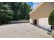 This home has an attached three car garage and a concrete parking area at 1811 Ascot Nw Cv, Acworth, GA 30102