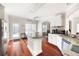 Bright kitchen features white cabinetry, stainless steel appliances, granite countertops, and a center island at 1811 Ascot Nw Cv, Acworth, GA 30102