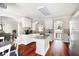 Kitchen features white cabinetry, granite countertops, a central island, and stainless steel appliances at 1811 Ascot Nw Cv, Acworth, GA 30102