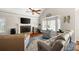 Cozy living room with vaulted ceilings, a brick fireplace, and plenty of natural light at 1811 Ascot Nw Cv, Acworth, GA 30102