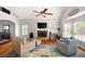 Bright living room with vaulted ceilings, brick fireplace, and hardwood flooring at 1811 Ascot Nw Cv, Acworth, GA 30102