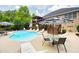 Inviting backyard with a sparkling pool, lounge chairs, and a covered deck, perfect for relaxing and entertaining at 1811 Ascot Nw Cv, Acworth, GA 30102