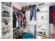 This walk-in closet offers ample storage space and has shelving units for clothes and accessories at 1811 Ascot Nw Cv, Acworth, GA 30102