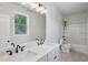 Bathroom features a double sink vanity and tub-shower combo at 3159 Stonegate Sw Dr, Atlanta, GA 30331
