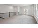 Spacious bonus room with railing and several windows at 3159 Stonegate Sw Dr, Atlanta, GA 30331