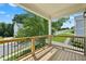Outdoor deck with wood railings, overlooking a landscaped yard and community lawn, perfect for entertaining at 3159 Stonegate Sw Dr, Atlanta, GA 30331