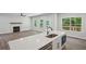 Gourmet kitchen with a large island, quartz countertops, stainless steel appliances, and an open floor plan concept at 3159 Stonegate Sw Dr, Atlanta, GA 30331