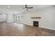 Inviting living room with hardwood floors, modern fireplace, and abundant natural light, perfect for entertaining and relaxation at 3159 Stonegate Sw Dr, Atlanta, GA 30331