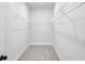 Bright walk-in closet with wire shelving and neutral carpeting, offering ample storage space at 3159 Stonegate Sw Dr, Atlanta, GA 30331