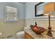 Stylish bathroom features a unique bowl sink, granite countertop, and modern fixtures at 6380 Concord Rd, Cumming, GA 30028
