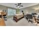 Bedroom with neutral tones, a comfortable bed, and a well-lit workspace at 6380 Concord Rd, Cumming, GA 30028