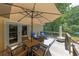 Outdoor deck featuring a dining set and lounge chairs, ideal for outdoor dining at 6380 Concord Rd, Cumming, GA 30028