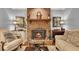 Inviting brick fireplace with a mantel, perfect for cozy evenings at 6380 Concord Rd, Cumming, GA 30028