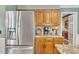 Updated kitchen with stainless steel fridge, granite counters, and plenty of storage at 6380 Concord Rd, Cumming, GA 30028