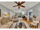 Bright living room with hardwood floors, comfortable furnishings, and large windows at 6380 Concord Rd, Cumming, GA 30028