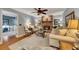 Cozy living room with a brick fireplace and comfortable seating arrangement at 6380 Concord Rd, Cumming, GA 30028