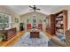 Cozy living room with hardwood floors, bright windows, and vaulted ceiling at 6380 Concord Rd, Cumming, GA 30028