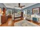 Spacious main bedroom with a four-poster bed and ensuite bathroom at 6380 Concord Rd, Cumming, GA 30028