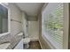 Bathroom featuring a granite countertop vanity, updated fixtures, and a shower at 1011 Darvin Nw Ln, Kennesaw, GA 30144