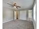 Spacious bedroom with carpet, a ceiling fan, and access to an attached bathroom at 1011 Darvin Nw Ln, Kennesaw, GA 30144