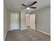 Comfortable bedroom with plush carpeting, a ceiling fan, and ample closet space at 1011 Darvin Nw Ln, Kennesaw, GA 30144