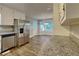 Modern kitchen with stainless steel appliances, granite countertops, and wood flooring at 1011 Darvin Nw Ln, Kennesaw, GA 30144
