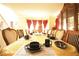 Formal dining room showcasing elegant table setting with stylish decor and a bay window at 1455 Duren Farms Dr, Lithonia, GA 30058
