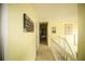 Hallway with white railings that leads down the stairs and wall decorations at 1455 Duren Farms Dr, Lithonia, GA 30058
