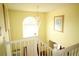 Upstairs hallway view featuring a chandelier, staircase, and lots of natural light at 1455 Duren Farms Dr, Lithonia, GA 30058