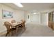 Finished basement with plush carpeting and dining table with chairs at 755 Creek Wind Ct, Johns Creek, GA 30097