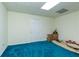 Unfinished basement featuring a door and plush blue carpeting at 755 Creek Wind Ct, Johns Creek, GA 30097