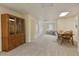 Spacious finished basement featuring plush carpeting, a dining set, and built in cabinet at 755 Creek Wind Ct, Johns Creek, GA 30097