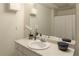 Bathroom with a white vanity, countertop and large mirror at 755 Creek Wind Ct, Johns Creek, GA 30097