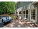 Inviting deck with wood flooring, railing, bench, and door leading indoors at 755 Creek Wind Ct, Johns Creek, GA 30097