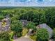 Charming brick two-story home featuring a well-manicured lawn and mature trees, offering a serene and private setting at 755 Creek Wind Ct, Johns Creek, GA 30097