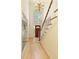 Bright foyer with hardwood floors, high ceilings, a chandelier, staircase and a large arched window at 755 Creek Wind Ct, Johns Creek, GA 30097