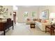 Living room with a couch, side table and entry way and neutral tones at 755 Creek Wind Ct, Johns Creek, GA 30097
