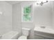 Bathroom with tub, tile surround, and vanity at 104 Southfork Dr, Woodstock, GA 30189