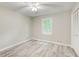 Bedroom with natural light and wood-look flooring at 104 Southfork Dr, Woodstock, GA 30189